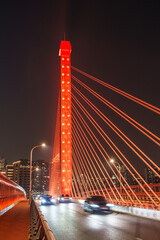 Obraz premium Red cable-stayed bridge at night