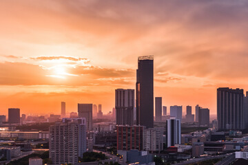 Fototapeta premium Panoramic skyline and modern commercial buildings with sunset views