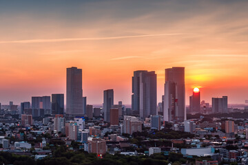 Panoramic skyline and modern commercial buildings with sunset views