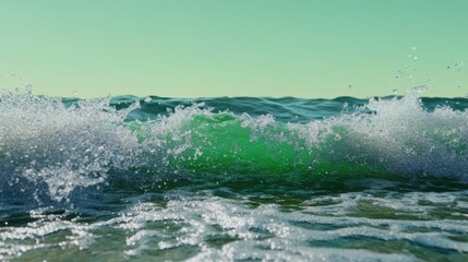 Close up view of a wave in the ocean with green water and light sky, showing wave splash
