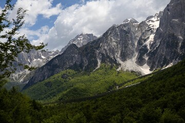 Majestic mountain range with lush forests.