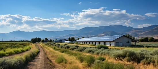 Farm and Mountains. Panoramic view of a farm with solar panels in the background