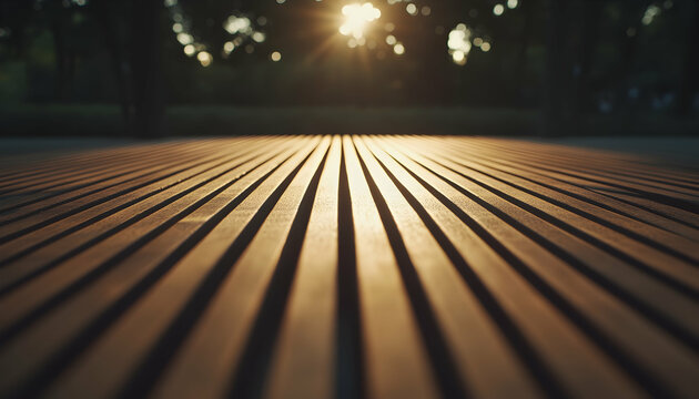 Golden sunlight illuminating parallel wooden planks, creating a warm and inviting outdoor scene.  Perfect for backgrounds, textures, and design projects.