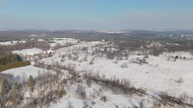 Scenic Rural Winter Landscape Covered In Snow At Caledon In Canada, Aerial Flyover.