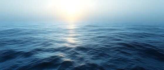 Obraz premium Calm ocean at sunrise, hazy sky.