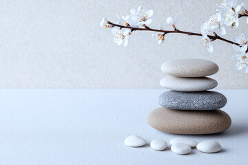 Minimalist art blending flowing water and rocks, soft textures, balanced composition, and serene essence