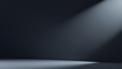 Minimalist studio with subtle ray of light illuminating a dark monochromatic scene