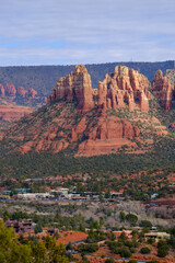 Rock formations, hills and plant life on a trek around Sedona Arizona.