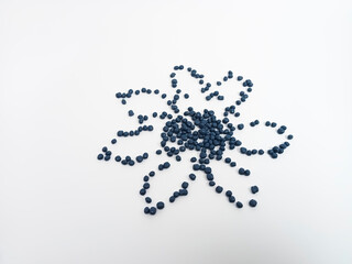 Navy masterbatch plastic granules, hot cutting type, colorful polymer pigment granules isolated on white background, for product catalog design of plastic manufacturing industry company profile	