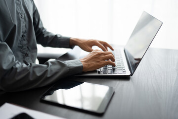 Business man working with laptop Hands typing  keyboard. Professional investor working new start up project. business planning in office. Technology business..