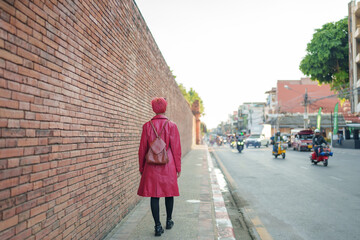 Gen z girl leather fashion with punk Asian woman tourist of local city Southeast Asia travel trendy...
