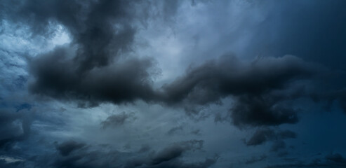Obraz premium Cloud storm sky dark halloween background rain lightning thunder stoumy typhoon Nature light scene rainy atmosphere damage effect carbon dioxide dust air pollution 2.5 Pm, texture nature windstorm.