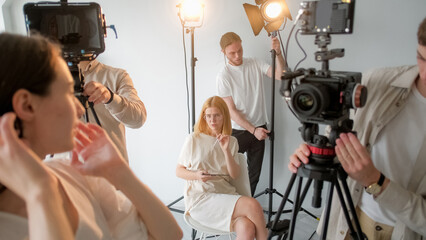 Art director studio. Videographer team. Female manager explains specifics work to employees....