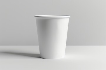 Single white disposable paper cup on white background. (1)