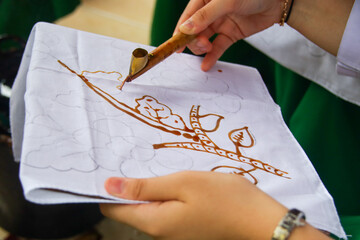training on the process of how to make batik cloth with a traditional tool called Canting.