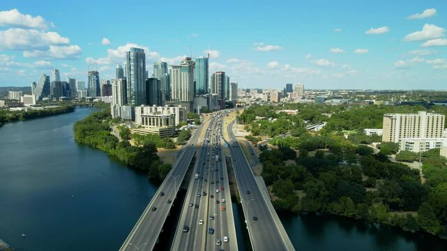 Downtown Austin I-35 Freeway Drone shoot on a sunny with moderate traffic. Drone shoot Interstate 35 crossing the Colorado rive