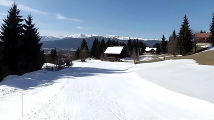 Sunny winter mountain slope, chalet view, snow-covered landscape, background mountains, ideal for winter sports tourism