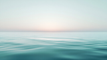 Obraz premium Calm waters reflect a pastel horizon at sunset over a tranquil sea