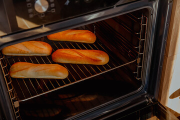 Freshly baked baguettes in oven