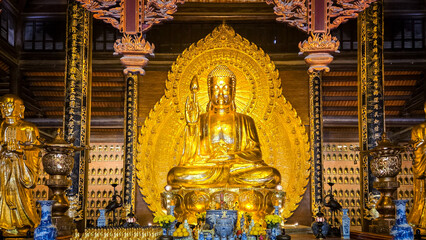 golden buddha statue in ninh binh