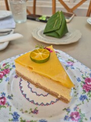 Classic piece of cheesecake serving on the plate. Famous traditional sweet dessert and bakery in restaurant.