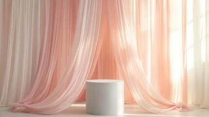 White podium surrounded by soft, flowing chiffon curtains in pastel pink