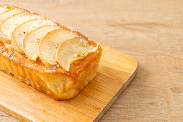apple loaf crumbled on wood board