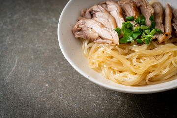 dried duck noodles in white bowl