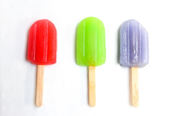 several colorful popsicles isolated on a white background