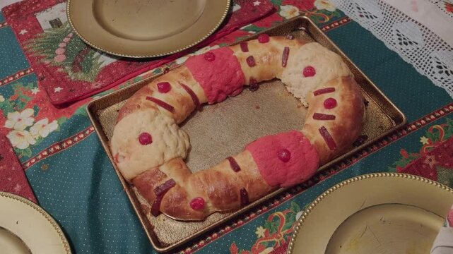 Rosca de on table with empty plates around