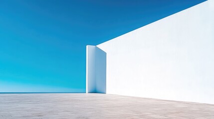 Blank white billboard displayed on an outdoor wall against a bright blue sky, offering space for promotional content and marketing details.