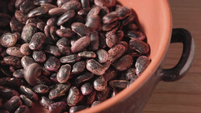Bunch of uncooked beans in bowl