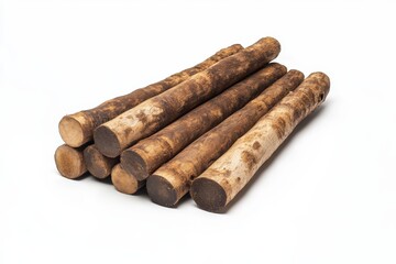 Stack of brown, cylindrical roots on white background.