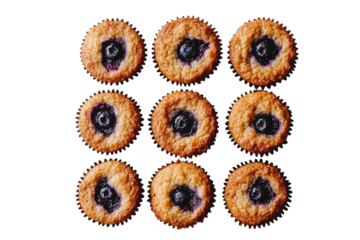 Freshly baked blueberry muffins arranged in a neat grid on a white surface