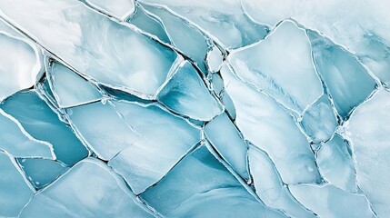 A fractured, light blue pattern of icy shards creates a mesmerizing, cool texture with intricate details and a translucent quality, resembling cracked ice or frozen mineral.