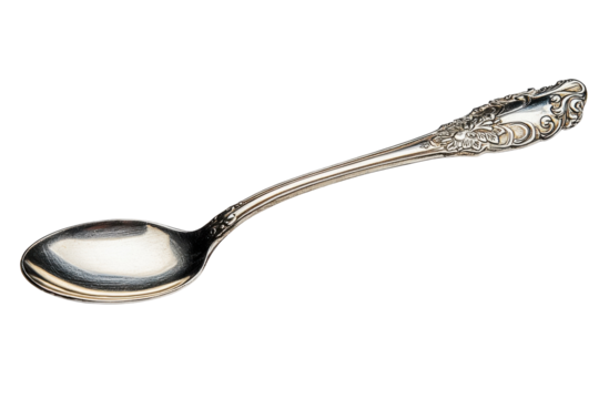 Elegant silver spoon with intricate design showcasing fine craftsmanship and classic beauty in dining setting