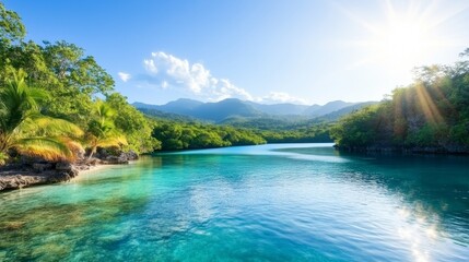 Obraz premium Tranquil Tropical Lagoon with Crystal Clear Water Surrounded by Lush Greenery and Sun-Kissed Mountains Under a Bright Blue Sky