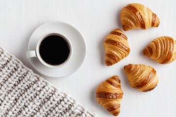 Warmth coziness well-being concept. Cozy morning scene with coffee and croissants on a textured surface, perfect for breakfast themes.