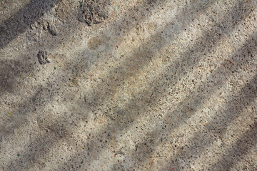 Abstract Sunlight Shadows on Rough Concrete Surface