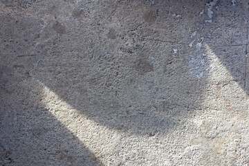 Abstract Sunlight Shadows on Rough Concrete Surface