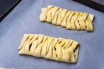 The process of making puff pastry with cream cheese and pecans. Baking concept. Homemade food. Baking cakes in the oven.
