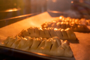 The process of making puff pastry. The concept of baking. Homemade food. Baking puff pastry in the oven.