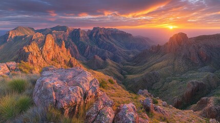 Fototapeta premium Of a rugged landscape at sunset, with the sun casting a golden glow across a mountain ridge