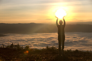 Silhouette of woman  praying over beautiful sunrise background, beautiful landscape, pay homage, spirituality and religion,man praying to god. Christianity concept.