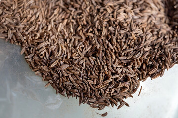 Close-up of cumin seeds in a bag