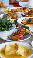 Indonesian traditional food from Minang Padang. Popular dishes from a Padang eatery, served on...