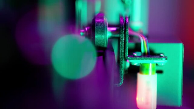 3d printer machine part robot arm roller manufacture prototype tool neon light lens bokeh blurred background