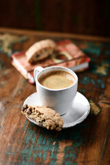 Cup of coffee and Cantuccini (Italian cookie) on dark wooden background. Copy space.	