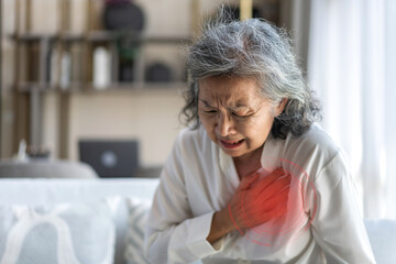 enior asian adult elderly woman with chest pain suffering from heart attack, health and medical, heart health, heart attack, world heart day, cardiovascular disease.insurance and hospital concept