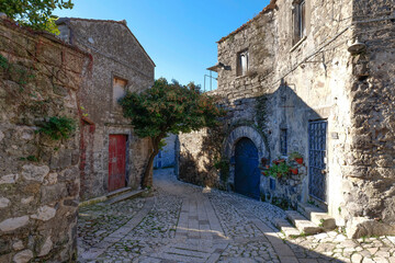 Naklejka premium A narrow street between the houses of old Caserta, a medieval village in Italy.